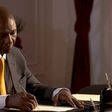 President William Ruto signs a document at State House