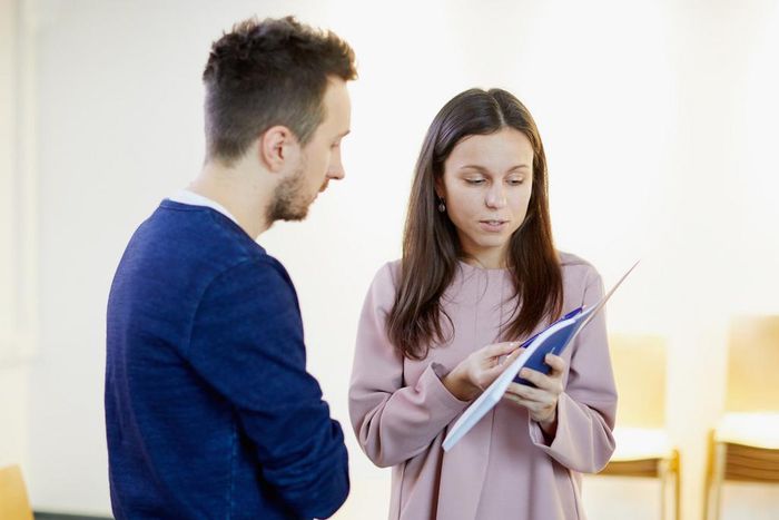 Woman work resume book talk boss employee