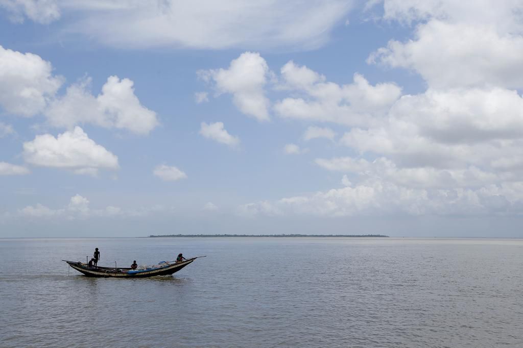 An island in India is disappearing, but some of the last residents say they can't afford to move away