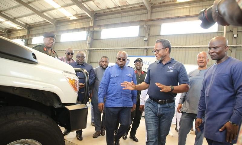 Mr-Kenneth-Akibate-middle-showing-some-of-the-assembled-vehicles-to-President-Akufo-Addo-on-tour-of-the-facility
