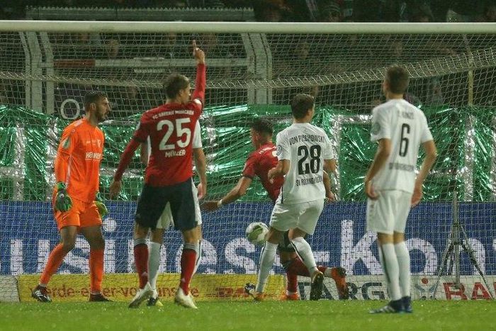 Bayern Munich forward Thomas Mueller celebrates converting a penalty in the 2-1 win at Roedinghausen