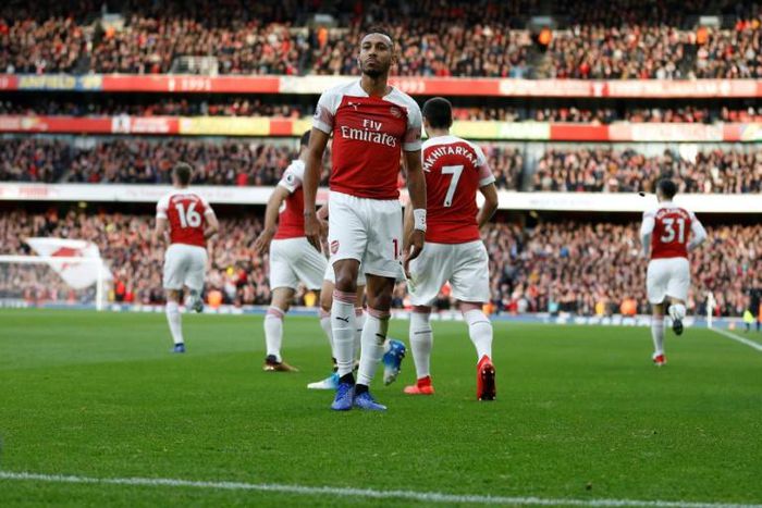 The Tottenham Hotspur fan who threw a banana skin onto the pitch during the match with Arsenal has been charged with throwing a missile and not a racially aggravated offence