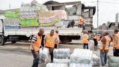 NADMO distributing relief items to flood and fire victims