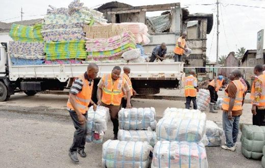 NADMO distributing relief items to flood and fire victims