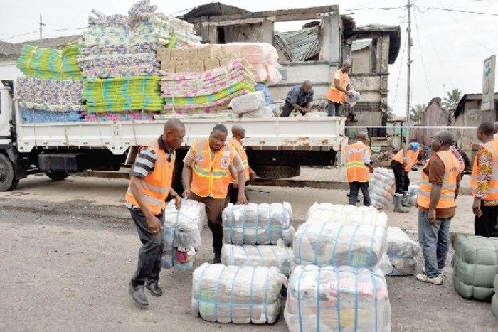 NADMO distributing relief items to flood and fire victims