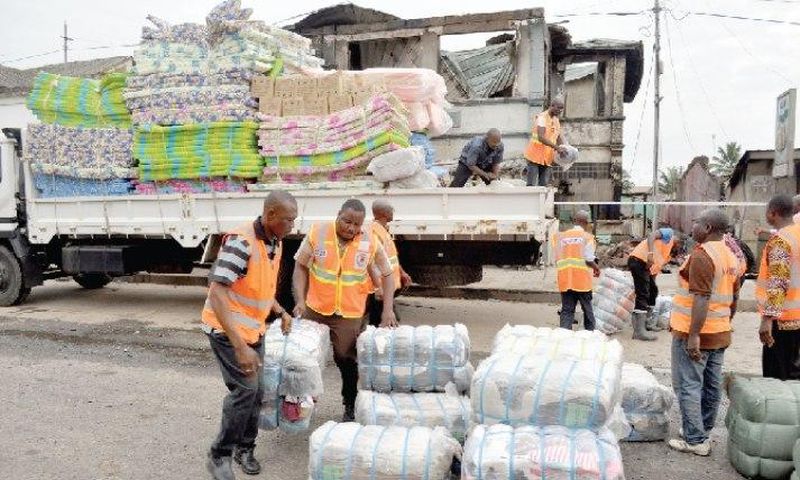 NADMO distributing relief items to flood and fire victims