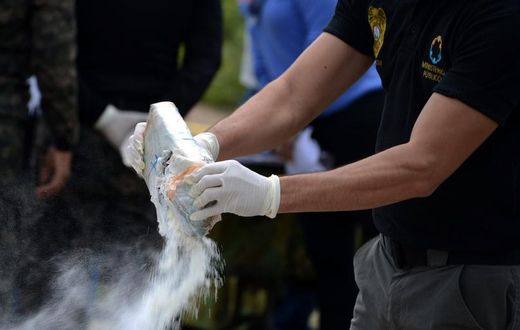 Anti-narcotics and military police officers prepare for the incineration of more than 200 kilos of cocaine seized in southern Honduras near the border with Nicaragua, August 5, 2016.Getty Images