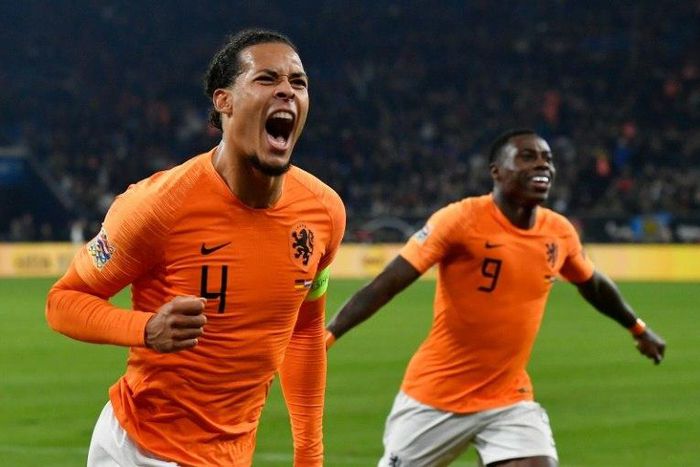 Netherlands' defender Virgil van Dijk (L) celebrates scoring in the 91st-minute to seal a 2-2 draw against Germany on Monday as the Dutch advance to the semi-finals of the Nations League at the expense of world champions France.