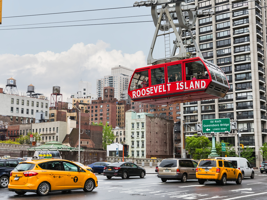 One of New York City's most affordable tourist experiences is a tram that takes you 250 feet above the city for the price of a subway fare