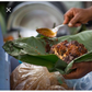 Waakye seller serving the food