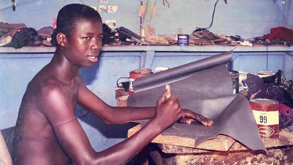 Kwaku Manu as a shoe maker