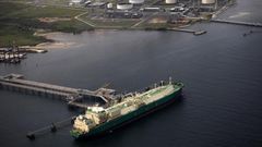 A ship berths near the Nigeria Liquified Natural Gas company (NLNG) near Finima village, during an aerial tour by the Royal Dutch Shell company, in Bonny March 22, 2013. REUTERS/Akintunde Akinleye