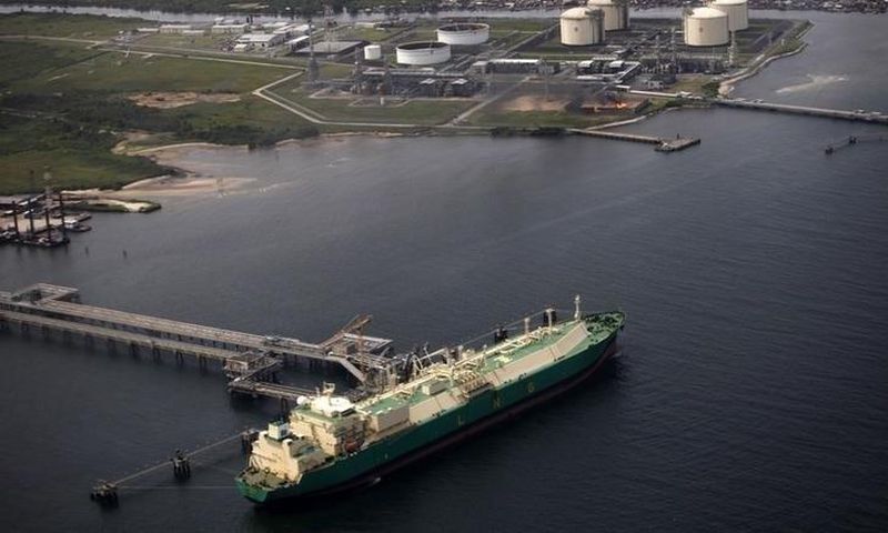 A ship berths near the Nigeria Liquified Natural Gas company (NLNG) near Finima village, during an aerial tour by the Royal Dutch Shell company, in Bonny March 22, 2013. REUTERS/Akintunde Akinleye