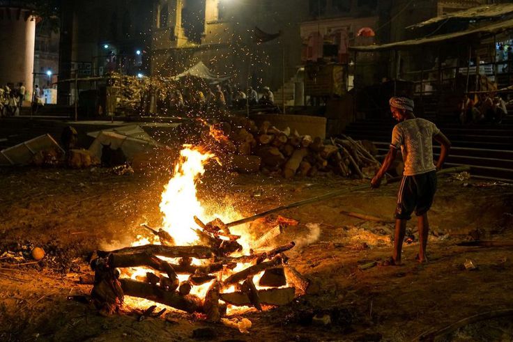 The Doms, a group belonging to a Hindu caste, earn their living by running the cremation pyres and maintaining the source fire that is used to light all of the pyres.