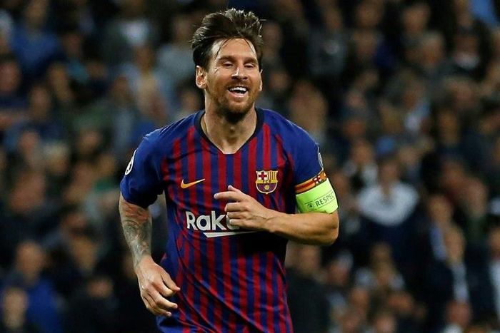Barcelona's Lionel Messi celebrates scoring his team's fourth goal against Tottenham