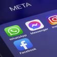 Logos of WhatsApp, Messenger, Instagram and Facebook apps belonging to the company Meta displayed on the screen of an iPhone.