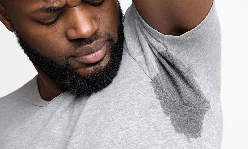 Man with sweaty and smally armpit