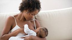 Stock photo: African nursing mother