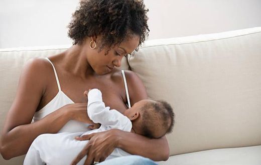Stock photo: African nursing mother