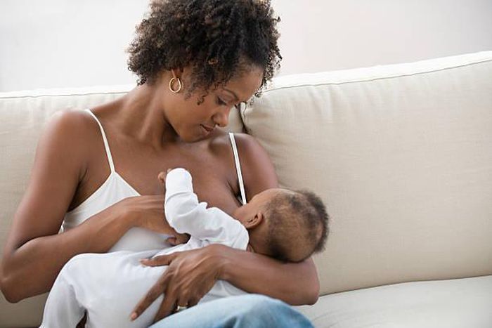 Stock photo: African nursing mother