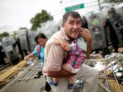 Powerful photos and stories from the caravan show migrants' harrowing journey to the US