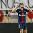 Edinson Cavani (R) celebrates after scoring one of his goals in Paris Saint-Germain's 4-0 win over Thierry Henry's Monaco