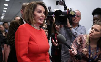 House Minority Leader Nancy Pelosi talks to reporters before heading into a Democratic caucus meeting in the Capitol on Nov. 14.
