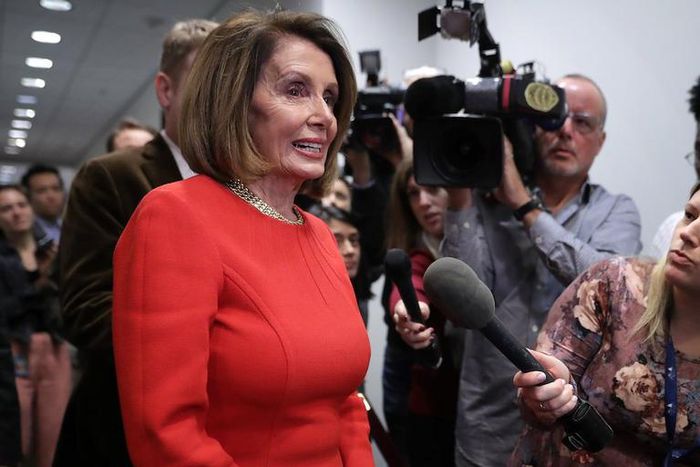 House Minority Leader Nancy Pelosi talks to reporters before heading into a Democratic caucus meeting in the Capitol on Nov. 14.
