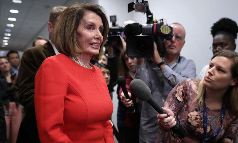 House Minority Leader Nancy Pelosi talks to reporters before heading into a Democratic caucus meeting in the Capitol on Nov. 14.
