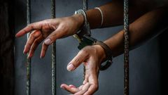Sock photo: Woman handcuffed