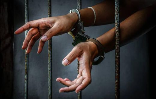 Sock photo: Woman handcuffed