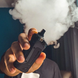 Person holding black Vape