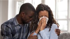 File photo: Man consoles weeping woman (Source: Shutterstock)