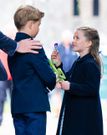 Hussein snapped this photo of Princess Charlotte, 7, showing her brother Prince George, 9, a flower during a visit to Wales.