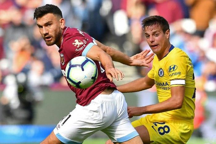 West Ham midfielder Robert Snodgrass (left) battles with Chelsea defender Cesar Azpilicueta during their Premier League clash at the London Stadium