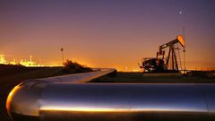 Oil prices have tumbled after the International Energy Agency cut its forecast for demand