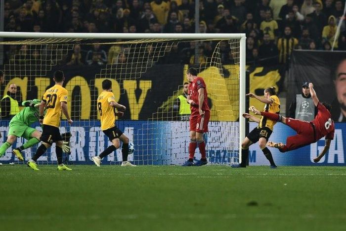 Bayern Munich midfielder Javi Martinez (R) scored the opening goal with a acrobatic half-volley before Robert Lewandowski (R) added a second as teh reigning German champions scored two second-half goals in as many minutes at AEK.