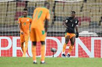 Ivory Coast captain Serge Aurier (R) finished the game in goal after Badra Ali Sangare hurt himself while conceding a bizarre equaliser