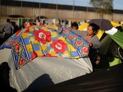 Powerful photos and stories from the caravan show migrants' harrowing journey to the US
