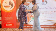 Mrs. Adelaide Siaw Agyepong, CEO of American International School, receiving her award at the 9th Feminine Ghana Achievement Awards in Accra.