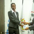 One of the 20 Ghanaian referees receive her Fifa badge