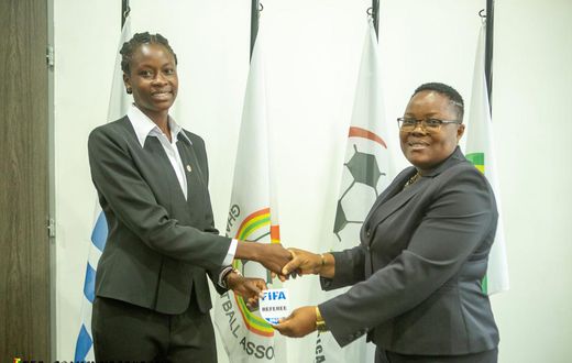 One of the 20 Ghanaian referees receive her Fifa badge