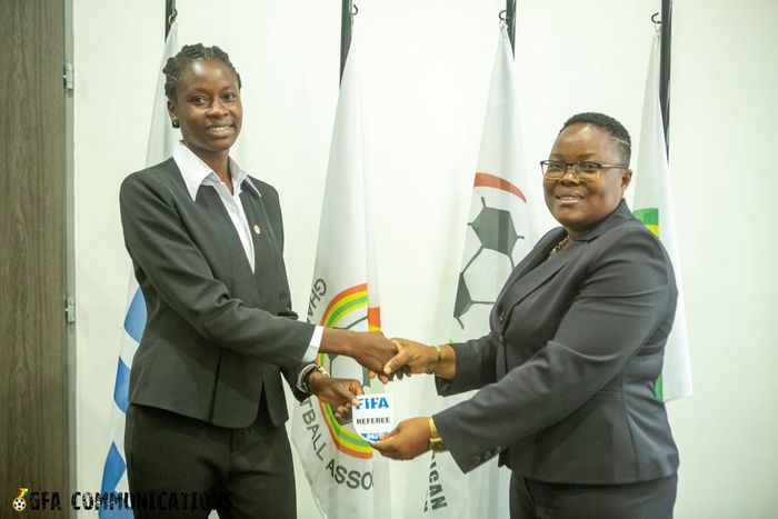 One of the 20 Ghanaian referees receive her Fifa badge