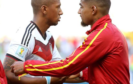Germany's Jerome Boateng (L) talk s with Ghana's Kevin-Prince Boateng before a Group G match between Germany and Ghana of 2014 FIFA World Cup at the Estadio Castelao Stadium in Fortaleza, Brazil on June 21, 2014.