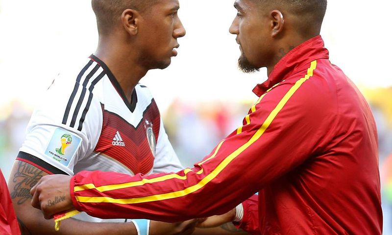 Germany's Jerome Boateng (L) talk s with Ghana's Kevin-Prince Boateng before a Group G match between Germany and Ghana of 2014 FIFA World Cup at the Estadio Castelao Stadium in Fortaleza, Brazil on June 21, 2014.