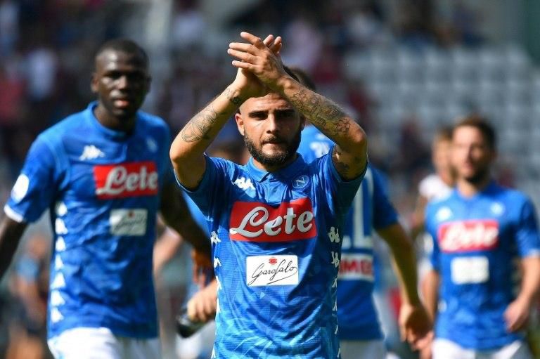 Lorenzo Insigne nets a brace as Napoli win 3-1 in Torino to join Juventus on top of Serie A.