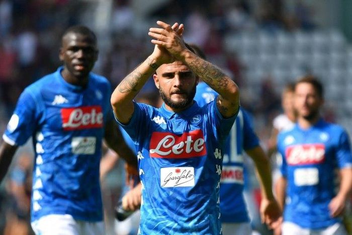 Lorenzo Insigne nets a brace as Napoli win 3-1 in Torino to join Juventus on top of Serie A.