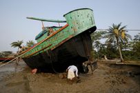 An island in India is disappearing, but some of the last residents say they can't afford to move away