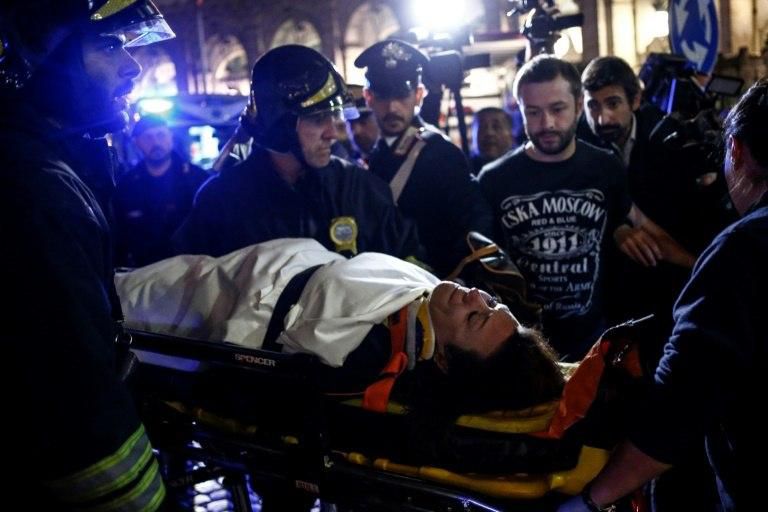 A woman was taken away from the scene on a stretcher by emergency crews