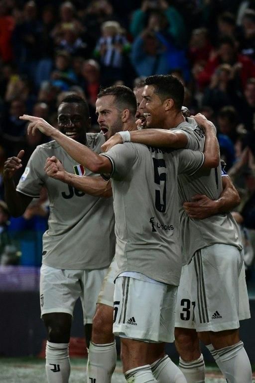 Cristiano Ronaldo celebrates with his teammates as Juventus won their tenth consecutive game.